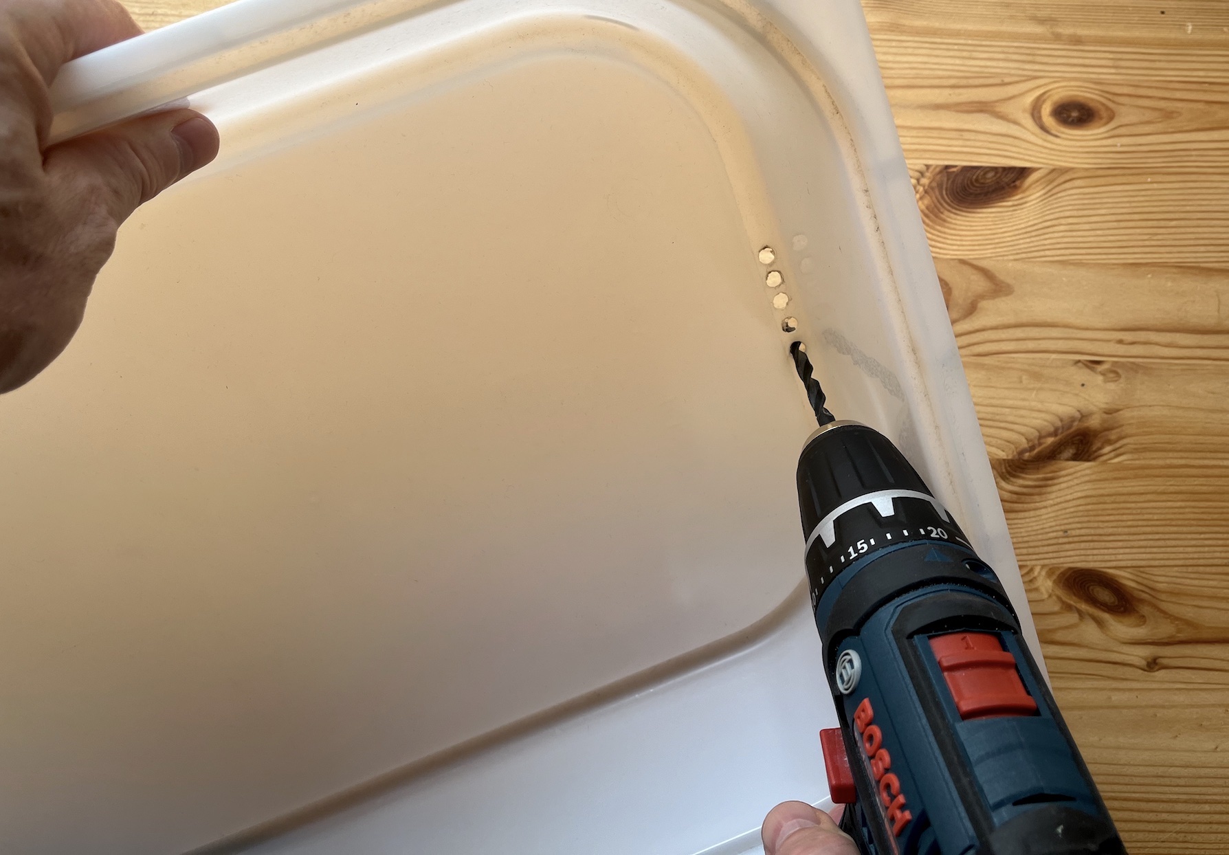 Drill at least 5 holes on each side of the washbasin.