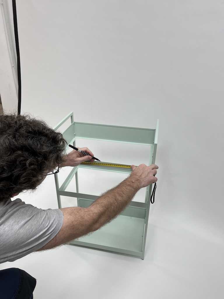 Mark drill point on the horizontal center of the top trays